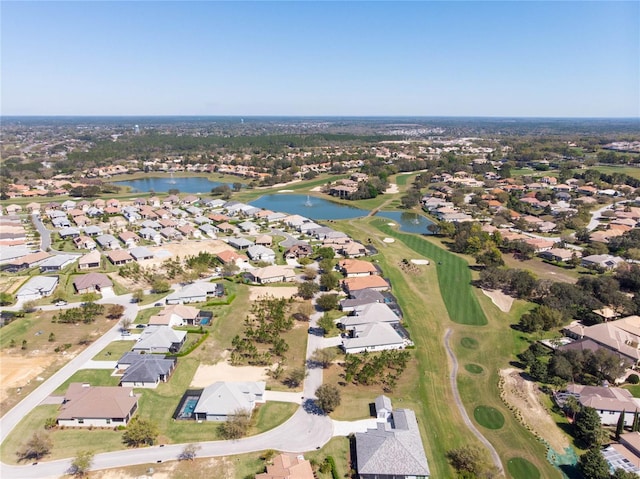 birds eye view of property with a residential view, a water view, and golf course view