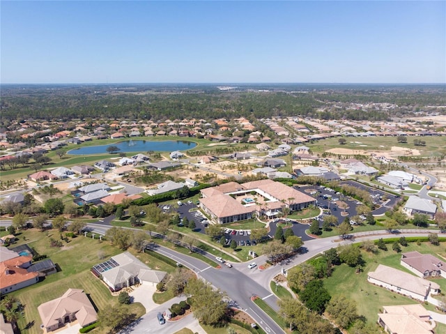 birds eye view of property with a residential view and a water view