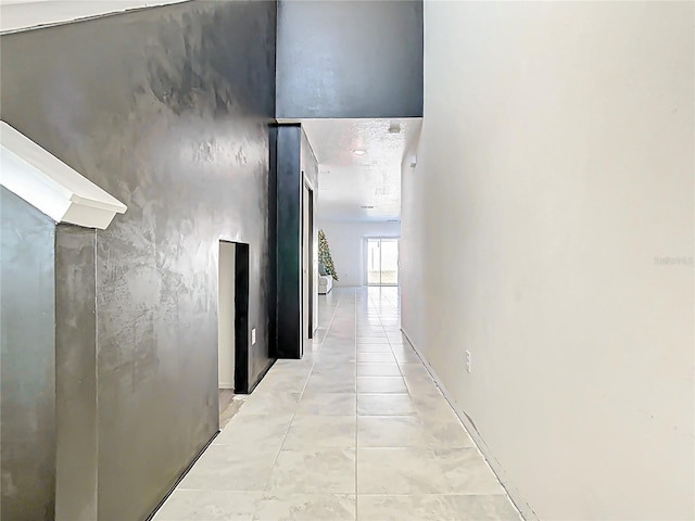 hallway with light tile patterned floors