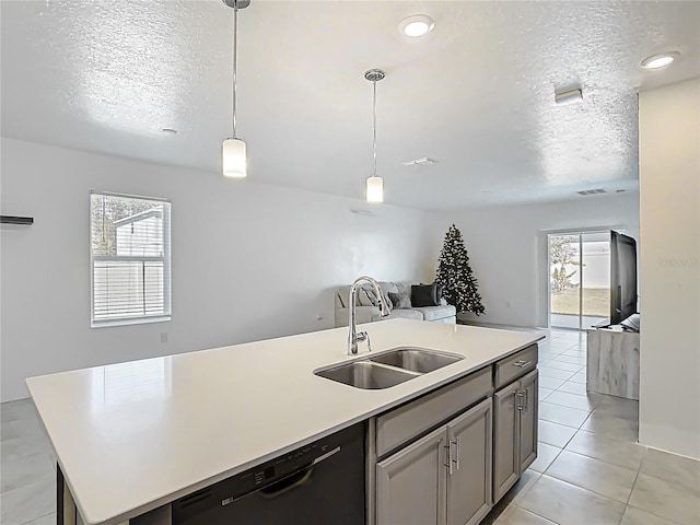 kitchen featuring a sink, black dishwasher, a healthy amount of sunlight, and open floor plan