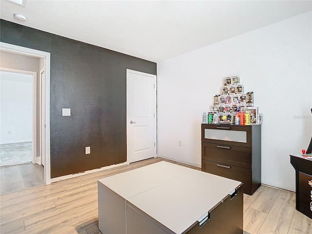 bedroom with light wood finished floors