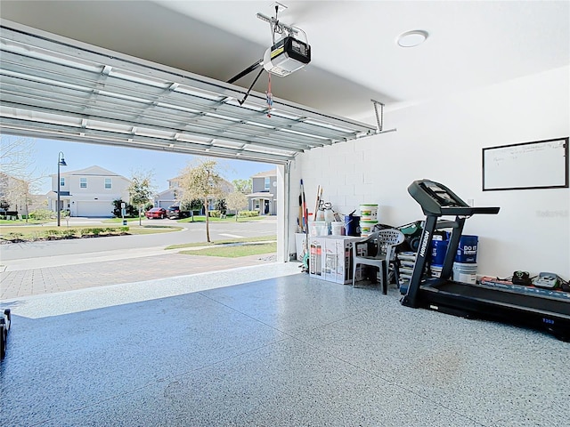 garage featuring a residential view and a garage door opener