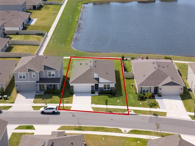 aerial view with a residential view and a water view