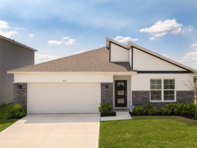 view of front of property with a garage, stone siding, driveway, and a front lawn