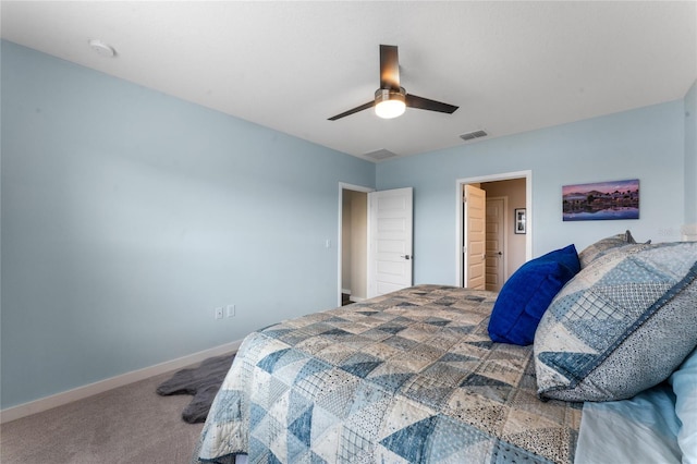 carpeted bedroom with visible vents, baseboards, and ceiling fan