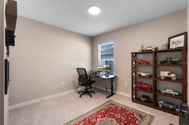 office area with light colored carpet and baseboards