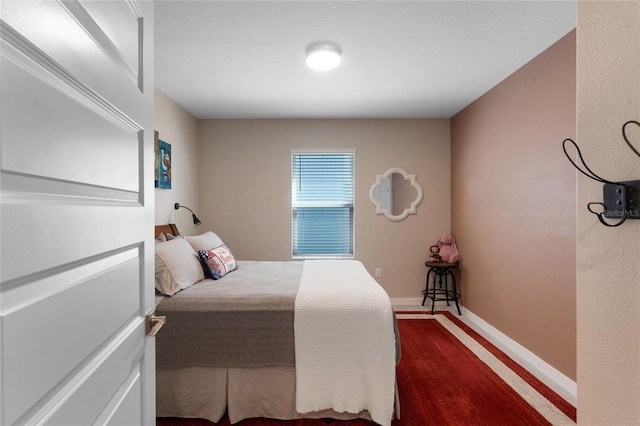 bedroom featuring baseboards