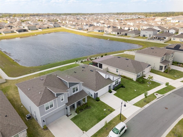 aerial view featuring a residential view and a water view