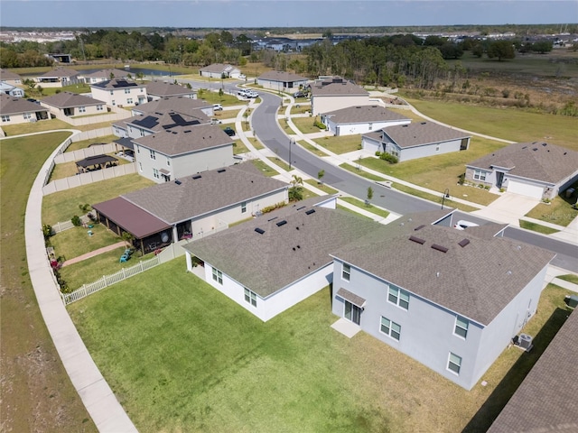 birds eye view of property with a residential view