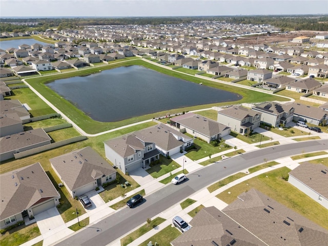 aerial view featuring a residential view and a water view