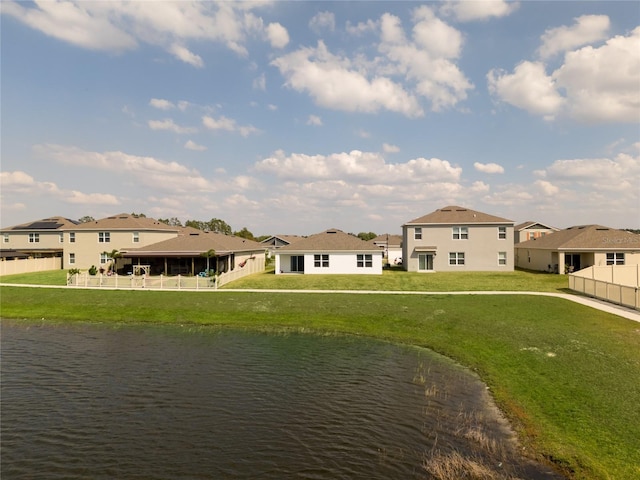 view of water feature featuring fence and a residential view