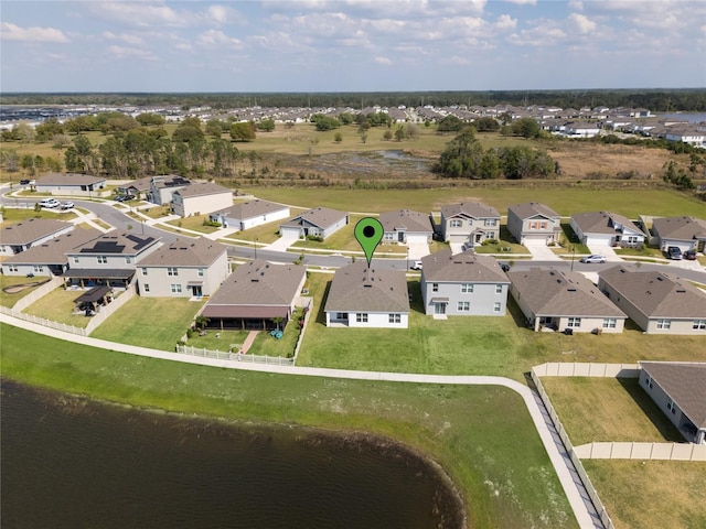 bird's eye view with a residential view and a water view