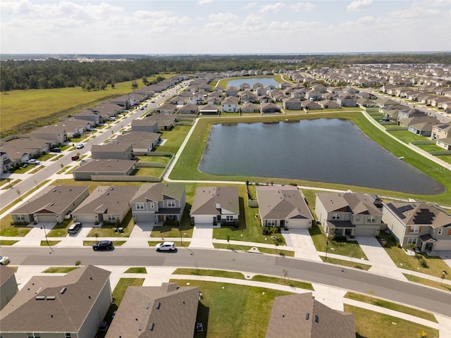 bird's eye view with a residential view and a water view