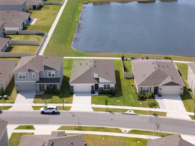 aerial view featuring a residential view and a water view