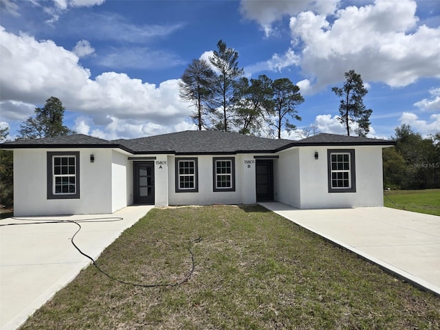 ranch-style home with a front yard, roof with shingles, and stucco siding