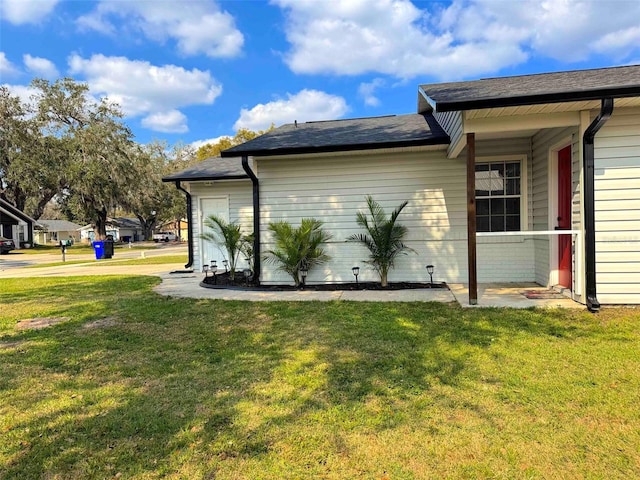 view of property exterior featuring a yard