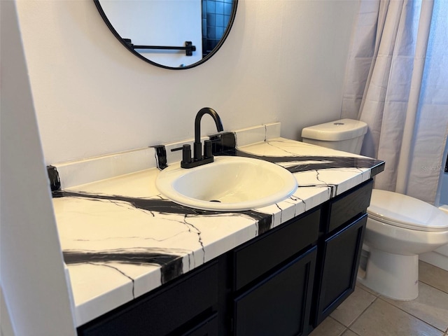 full bath with tile patterned floors, a shower with curtain, toilet, and vanity