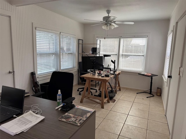 home office with light tile patterned flooring and a ceiling fan