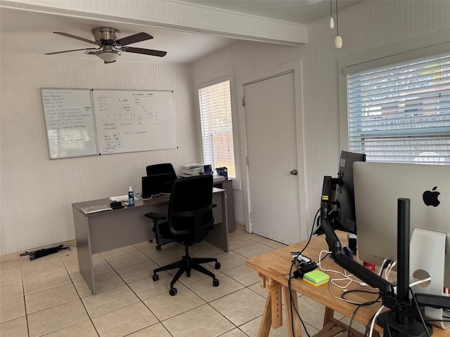 office area with light tile patterned floors and ceiling fan