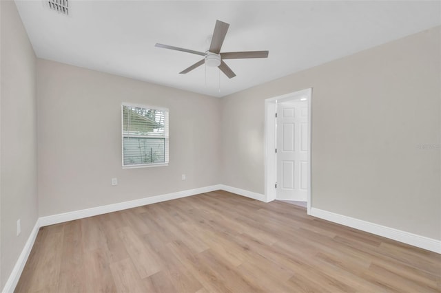 unfurnished room featuring visible vents, baseboards, a ceiling fan, and light wood finished floors