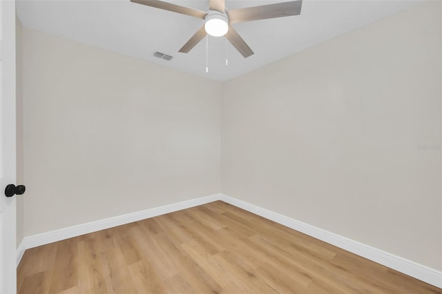 unfurnished room with light wood-type flooring, baseboards, visible vents, and ceiling fan