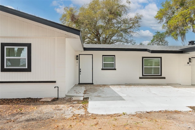 property entrance with a patio area