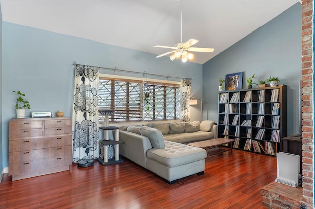 living room featuring a ceiling fan, lofted ceiling, and wood finished floors