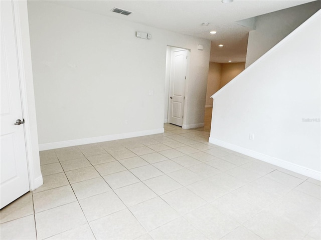 unfurnished room featuring visible vents, recessed lighting, stairway, and baseboards