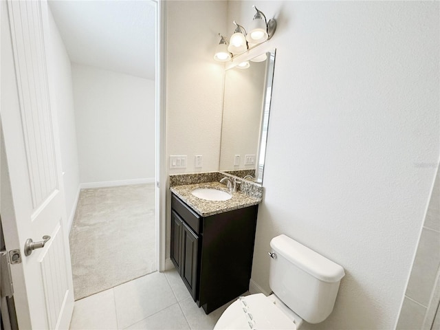 bathroom with tile patterned floors, toilet, and vanity