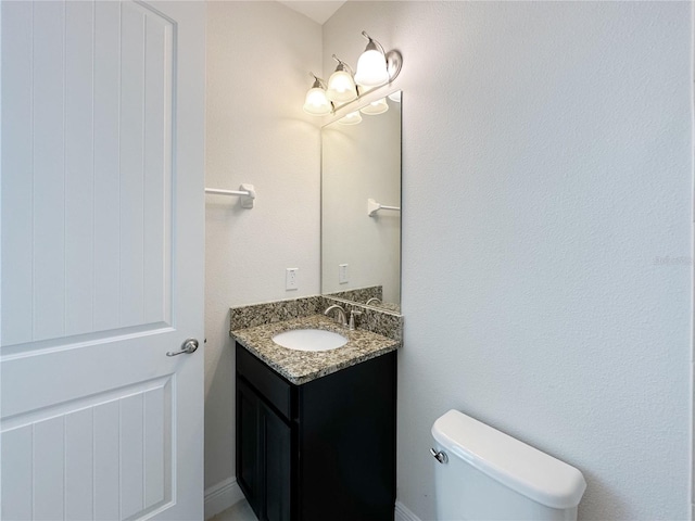 half bath with toilet and vanity