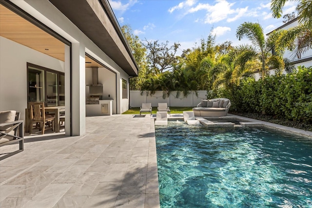 view of swimming pool featuring a fenced in pool, a patio, area for grilling, and a fenced backyard