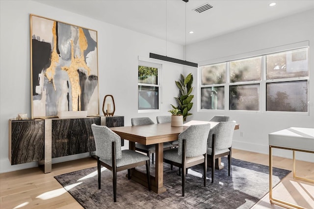 dining space featuring visible vents, recessed lighting, baseboards, and wood finished floors