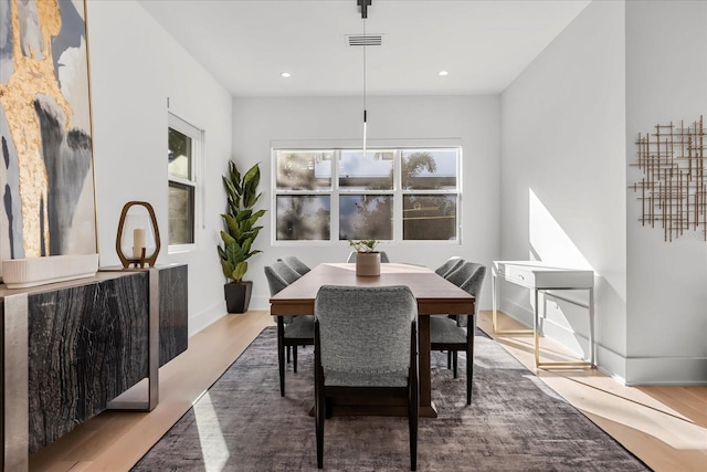 dining area featuring recessed lighting, wood finished floors, visible vents, and baseboards