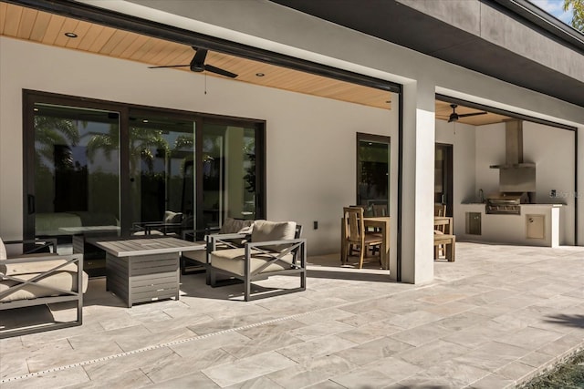 view of patio / terrace with an outdoor living space, area for grilling, a grill, and ceiling fan