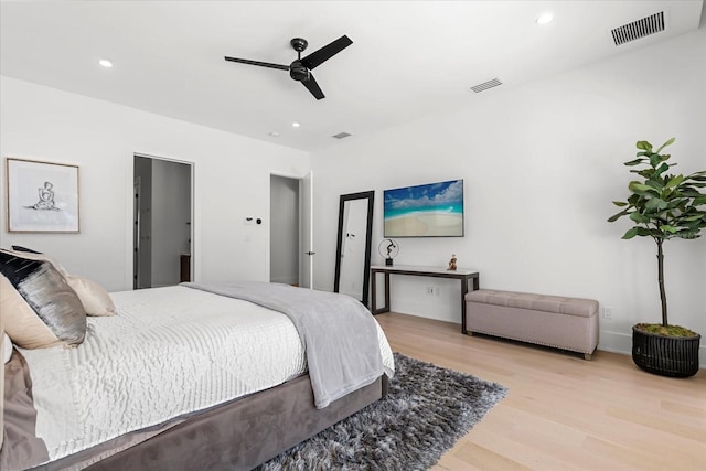 bedroom featuring recessed lighting, wood finished floors, visible vents, and ceiling fan