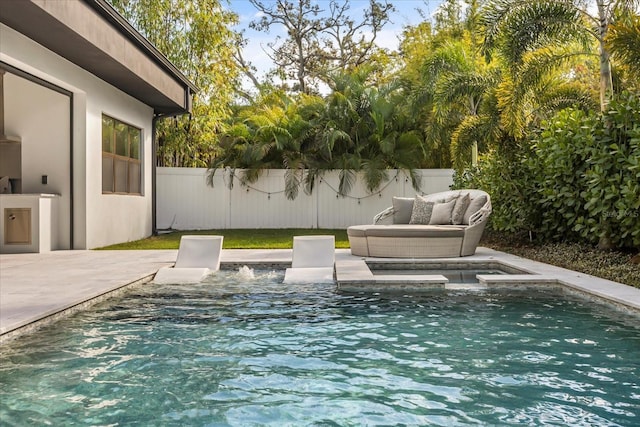 view of pool with a patio area and a fenced backyard