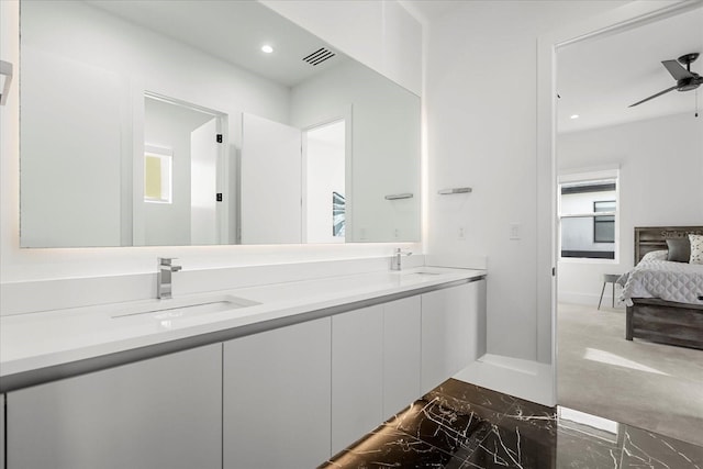 full bath with double vanity, visible vents, marble finish floor, and a sink