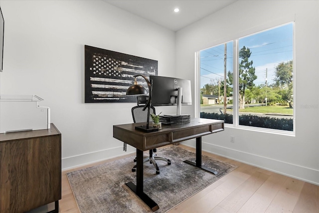 office with recessed lighting, wood finished floors, and baseboards