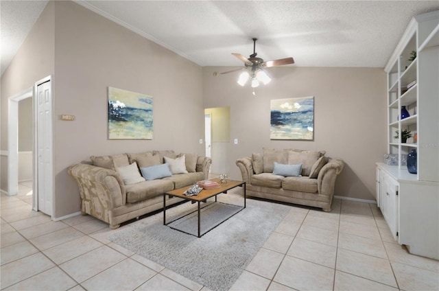 living room featuring lofted ceiling, light tile patterned floors, a ceiling fan, and a textured ceiling