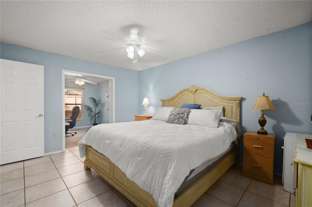 bedroom featuring light tile patterned floors, a textured ceiling, and a ceiling fan