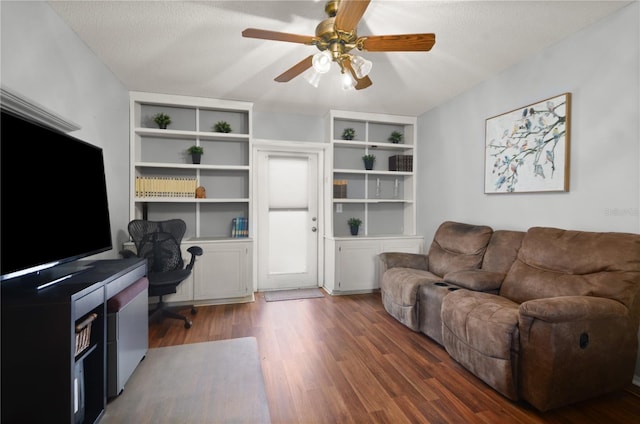 office area with a ceiling fan, wood finished floors, and a textured ceiling