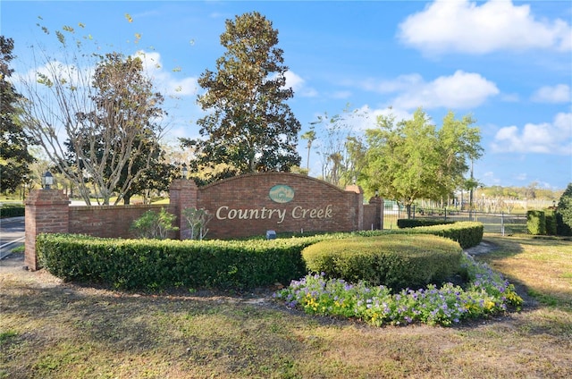 community sign with fence