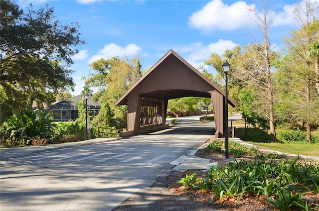 view of property's community with concrete driveway