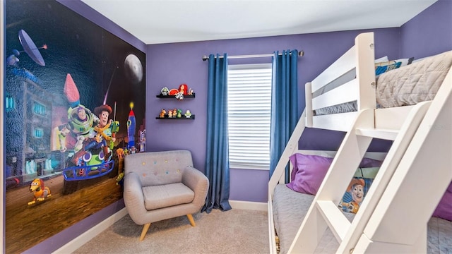 bedroom with baseboards and carpet floors