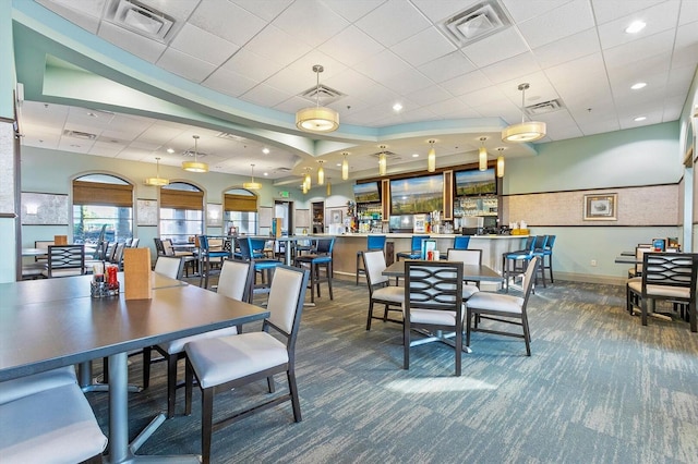 dining area featuring visible vents and carpet