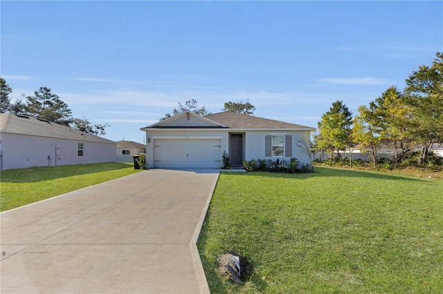 view of front of house with a front yard, an attached garage, driveway, and stucco siding