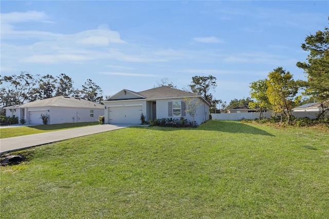 view of front of home featuring stucco siding, a front lawn, driveway, fence, and a garage