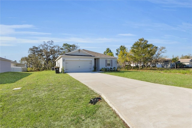 single story home with a front yard, a garage, and driveway