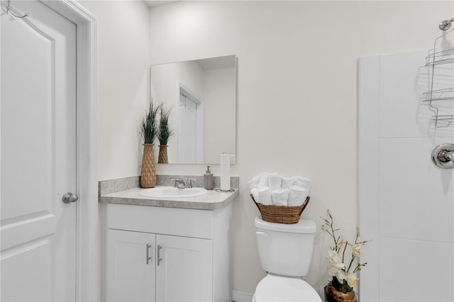 bathroom with toilet and vanity