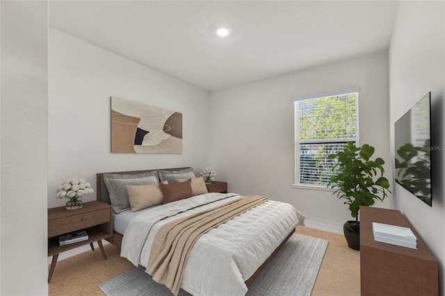 carpeted bedroom with baseboards